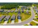 Aerial view showing a new residential community with modern homes, green lawns, and well-planned streets at 1032 Peridote Way, Ladson, SC 29456
