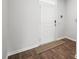Clean entryway with a secure front door and a neutral-colored mat on wood-style flooring at 1032 Peridote Way, Ladson, SC 29456