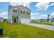 A delightful two-story home featuring a lush lawn and a convenient two-car garage, perfect for families at 1032 Peridote Way, Ladson, SC 29456