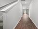 Inviting hallway featuring clean lines, fresh paint, hardwood floors, and easy access to living spaces at 1032 Peridote Way, Ladson, SC 29456