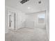 Bright upstairs hallway with neutral carpet leading to multiple doors and a window at 1032 Peridote Way, Ladson, SC 29456
