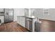 Spacious kitchen island with stainless steel dishwasher and granite countertops at 1032 Peridote Way, Ladson, SC 29456
