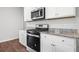Modern kitchen showcasing stainless steel gas range and granite countertops at 1032 Peridote Way, Ladson, SC 29456