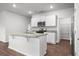 Open kitchen with granite countertops, stainless steel appliances, and ample storage space at 1032 Peridote Way, Ladson, SC 29456