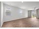 Bright, open living room features wood-look floors and a sliding glass door to the backyard at 1032 Peridote Way, Ladson, SC 29456
