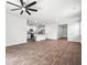 Open concept living space with wood floors seamlessly flowing into a well-equipped kitchen at 1032 Peridote Way, Ladson, SC 29456