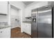 View of the kitchen with a walk-in pantry and stainless steel refrigerator at 1032 Peridote Way, Ladson, SC 29456
