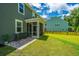 Wide backyard, showing the home's siding and a nice patio at 104 Limpkin Ln, Summerville, SC 29483