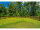 Large, well-maintained backyard with a privacy fence and lush green grass at 104 Limpkin Ln, Summerville, SC 29483