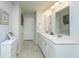 Bathroom featuring a double vanity, quartz countertops, and tile flooring at 104 Limpkin Ln, Summerville, SC 29483