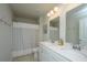 Bathroom featuring a double vanity with framed mirrors, and a shower with striped curtain at 104 Limpkin Ln, Summerville, SC 29483