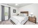 Cozy bedroom with neutral colors, comfortable queen-sized bed, and matching nightstands at 104 Limpkin Ln, Summerville, SC 29483