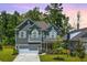 Charming two-story home with manicured lawn and attached two-car garage at 104 Limpkin Ln, Summerville, SC 29483