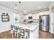 Modern kitchen with white cabinets, stainless steel appliances, and granite countertops at 104 Limpkin Ln, Summerville, SC 29483