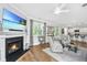 Bright and airy living room featuring a fireplace, hardwood floors, and open layout at 104 Limpkin Ln, Summerville, SC 29483