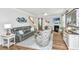 Bright living room featuring hardwood floors, fireplace, and comfortable seating at 104 Limpkin Ln, Summerville, SC 29483