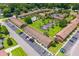 Aerial image showing townhomes with a community pool, tennis court, lush landscaping, and parking areas at 107 Hickory Ln # C, Ladson, SC 29456
