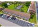 An aerial view showcasing the townhome complex with a community pool, tennis courts and ample parking at 107 Hickory Ln # C, Ladson, SC 29456