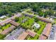 Aerial view highlighting the community's townhomes, pool, tennis court, lush green spaces, and parking at 107 Hickory Ln # C, Ladson, SC 29456