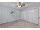 Neutral bedroom with ceiling fan, carpeted floors, double closets, and natural light from window at 107 Hickory Ln # C, Ladson, SC 29456