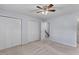 Spacious bedroom with carpet, ceiling fan, and double door closets for ample storage at 107 Hickory Ln # C, Ladson, SC 29456
