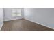 Bedroom features new laminate flooring, neutral paint, and a large window at 107 Hickory Ln # C, Ladson, SC 29456