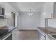 Bright kitchen features stainless steel appliances and opens to a dining area with sliding door access at 107 Hickory Ln # C, Ladson, SC 29456