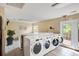 Well-maintained laundry room with multiple washers and dryers for residents at 107 Hickory Ln # C, Ladson, SC 29456