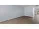 Spacious living area with laminate flooring, neutral paint, and access to the kitchen at 107 Hickory Ln # C, Ladson, SC 29456