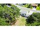 Aerial view of home with wooden deck, lush green yard, and mature trees at 107 Sugarpine Pl, Summerville, SC 29486