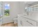 Modern bathroom with white vanity, new fixtures, a large mirror, and great natural light at 107 Sugarpine Pl, Summerville, SC 29486