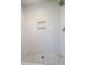 Walk in shower with white textured walls, a shower head, and gray tiled floor at 107 Sugarpine Pl, Summerville, SC 29486