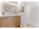 Modern bathroom with stylish vanity, gold framed mirror, and walk-in shower at 107 Sugarpine Pl, Summerville, SC 29486