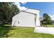 Home featuring horizontal white siding with black trim, and freshly poured driveway and sidewalk at 107 Sugarpine Pl, Summerville, SC 29486