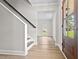 Bright Foyer featuring hardwood floors, stairs, and a lovely front door at 107 Sugarpine Pl, Summerville, SC 29486