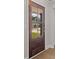 Stylish wooden front door with glass panels offering a glimpse of the outdoors at 107 Sugarpine Pl, Summerville, SC 29486
