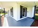 Exterior view showcasing a long porch with black shutters and gray flooring at 107 Sugarpine Pl, Summerville, SC 29486