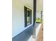 Charming front porch with black window shutters and painted columns at 107 Sugarpine Pl, Summerville, SC 29486