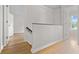 Bright hallway with hardwood floors, doors to bedrooms and bathrooms at 107 Sugarpine Pl, Summerville, SC 29486