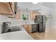 Modern kitchen featuring white countertops, tile backsplash, and stainless steel appliances at 107 Sugarpine Pl, Summerville, SC 29486