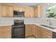 Bright kitchen features stainless steel appliances, and herringbone backsplash at 107 Sugarpine Pl, Summerville, SC 29486
