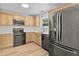 Updated kitchen features stainless steel appliances, and wood cabinets at 107 Sugarpine Pl, Summerville, SC 29486