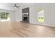 Spacious living room with a stone fireplace and hardwood floors at 107 Sugarpine Pl, Summerville, SC 29486