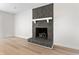 Living room featuring a stone fireplace and hardwood floors at 107 Sugarpine Pl, Summerville, SC 29486