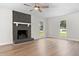 Spacious living room with a stone fireplace and hardwood floors at 107 Sugarpine Pl, Summerville, SC 29486