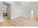 Bright living room featuring wood-look floors and modern lighting at 107 Sugarpine Pl, Summerville, SC 29486