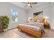 Bright main bedroom with wood flooring, large windows, a bed, and nightstands at 107 Sugarpine Pl, Summerville, SC 29486