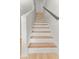 Elegant staircase features light wood treads with white risers and a painted handrail at 107 Sugarpine Pl, Summerville, SC 29486