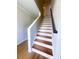 Elegant staircase features light wood treads with white risers and a painted handrail at 107 Sugarpine Pl, Summerville, SC 29486