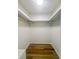 Walk-in closet with wood flooring and metal hanging rods at 107 Sugarpine Pl, Summerville, SC 29486